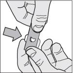 Ta ut en tablett: trykk forsiktig den ene enden av tabletten gjennom folien.