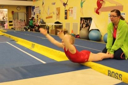 A spotter holds the athlete s ankles. DIRECTIONS: The athlete lifts their upper body up so their body is parallel to the floor.