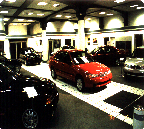 leder Bjørn Inge Knudsen forteller at året 1996 var ny giv for Jæger Sentrum med BMW og Rover biler.