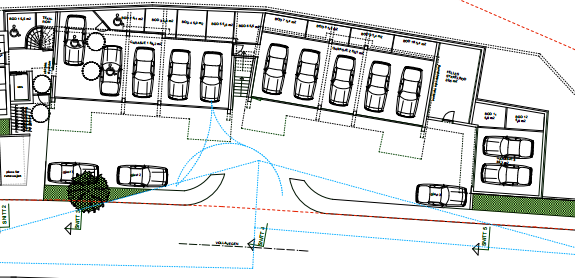 illustrasjonstegninger vises en del av garasjeanlegget i sør (med to parkeringsplasser) delvis utenfor byggegrensen og kun 2,5 meter fra vegkant (se figur 5).