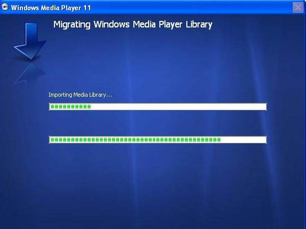 Merk Ditt eksisterende mediakartotek migrerer nå til Windows Media Player 11.