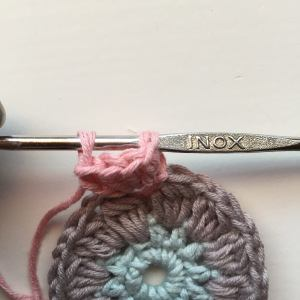 Make a loop on your last stitch. Pull out hook and insert the hook trough the third ch in your first dc (its just the first one that can be tricky. Its easier with the next ones!