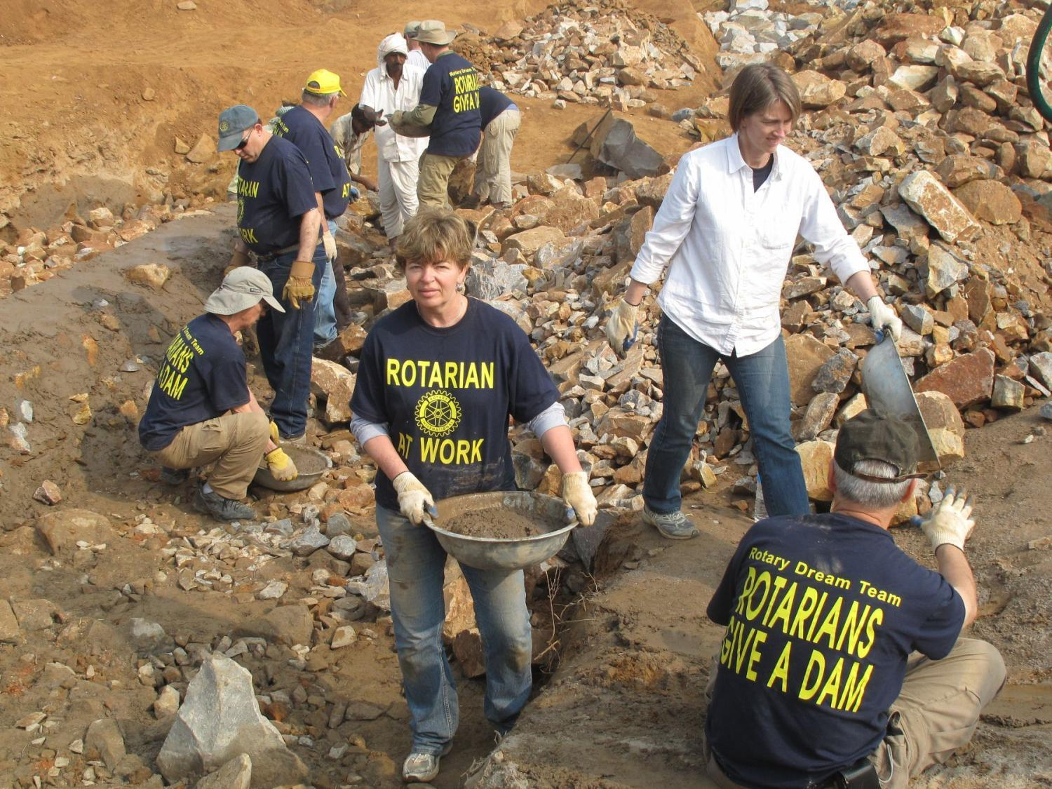 Rotarians Building a Dam in