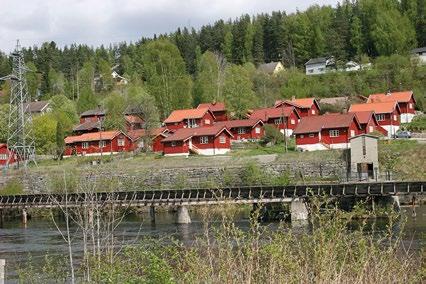 fra før 1900 og ligger på vestsiden av Tinnåa, i området rundt fabrikken. Karbidfabrikken rekrutterte faglærte arbeidere utenfra (bl.a. Sverige), og oppførte et stort tømmerhus, «Karbidboligen», for losji.