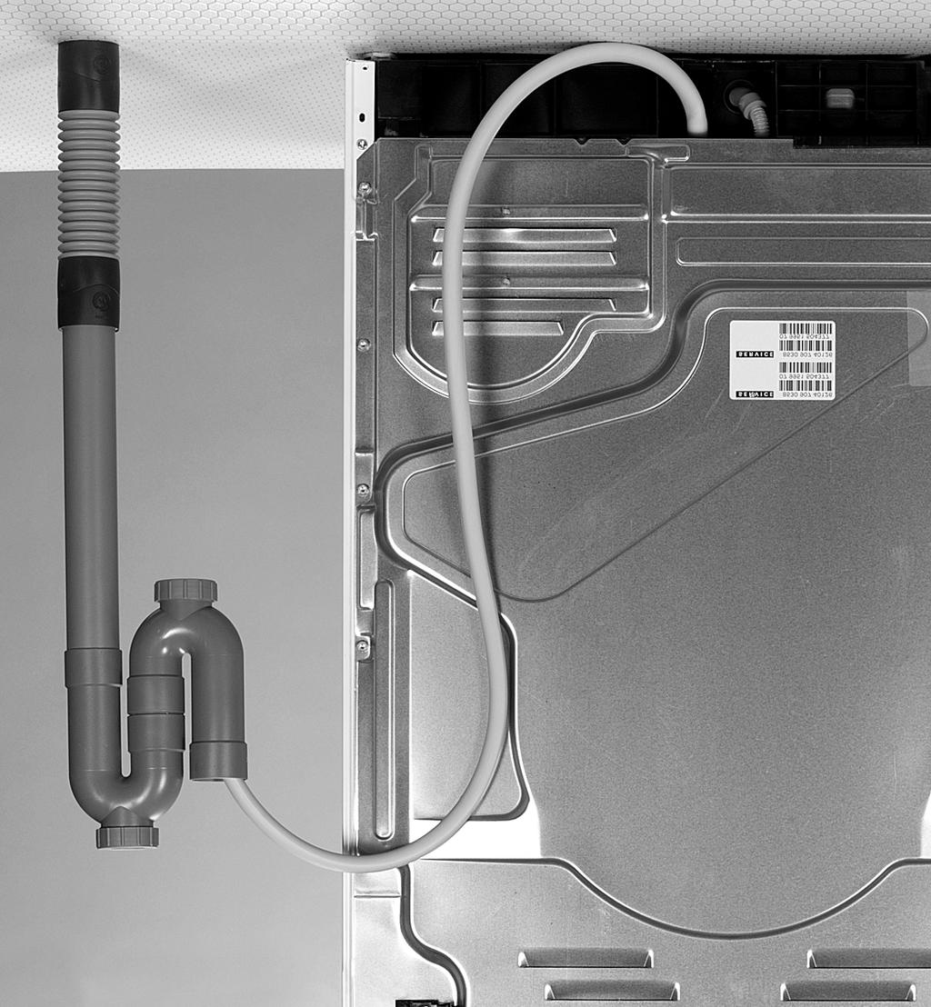 2 Tilkoblingen for direkte tømming er plassert bak på tørketrommelen. 1. Legg en absorberende klut under for å samle opp vannsøl. 2.