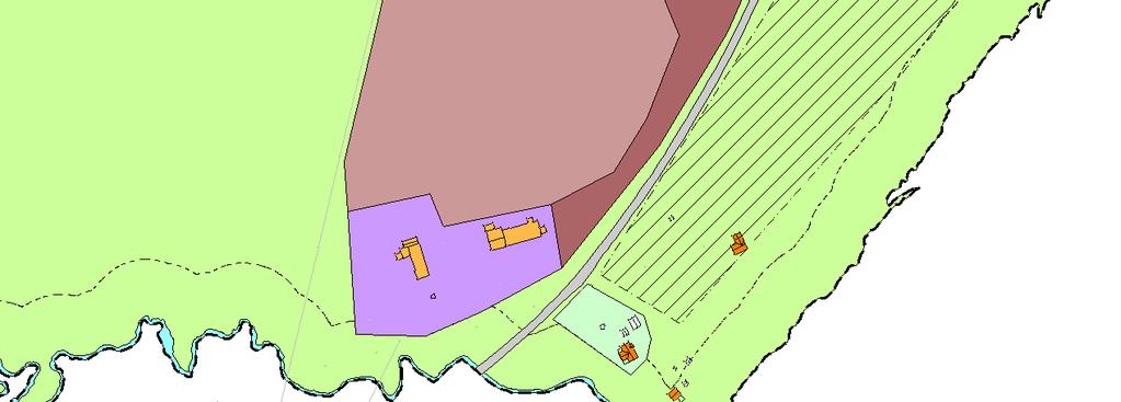 Kartutsnitt som viser området avsatt til eksisterende og framtidig råstoffutvinning i kommunedelplan for sentrumsområdet (lys og mørk rødbrun farge). 2.