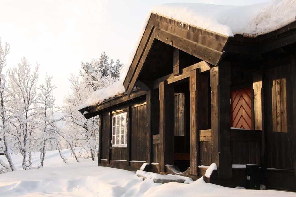 Hvit jul Skikkelig julestemning med stavlaft-hytte. Hyttemodell Skardfjell.