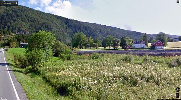 Eksisterende bebyggelse Bildet nedenfor viser deler av dagens situasjonen langs E6 og jernbanen sett fra Grennebakken i nord mot Vuddudalen i sør.