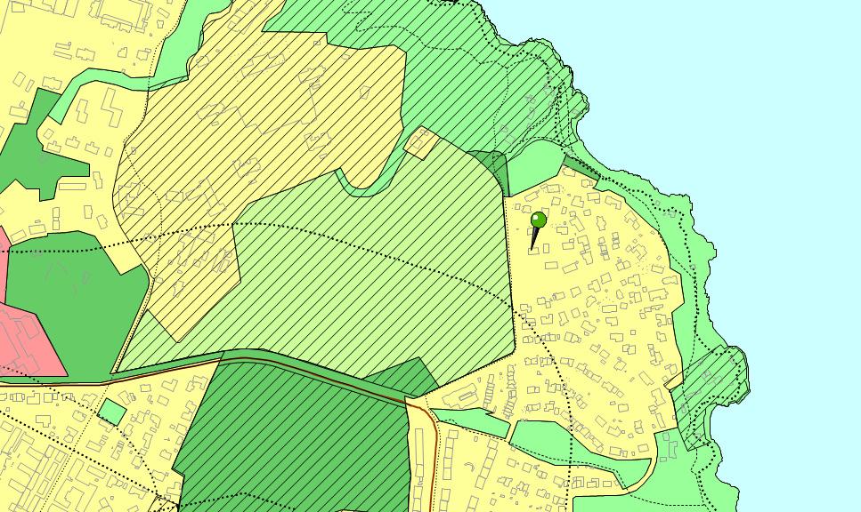 Utsnitt av kommuneplanens arealdel, Karisvingen merket med pil med grønt hode. Arealer meg gul farge er boligområder.