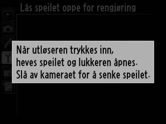 4 Trykk på J. Meldingen til høyre vises på skjermen, og en rad med streker vises i det øvre kontrollpanelet og søkeren.