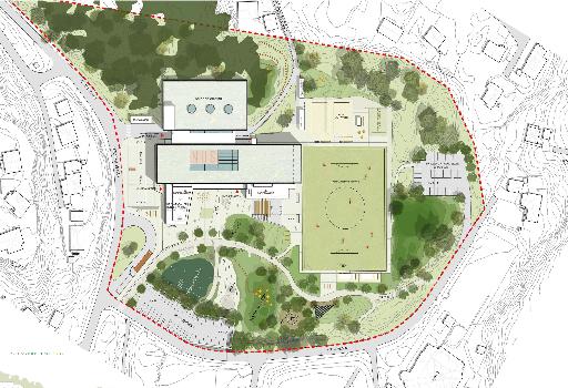 Grepet er mulig ved at idrettshallen sprenges inn i Fjellsmogehaugen. Prosjektet skiller seg ut ved at hovedinngangen er plassert sentralt i skolegården.