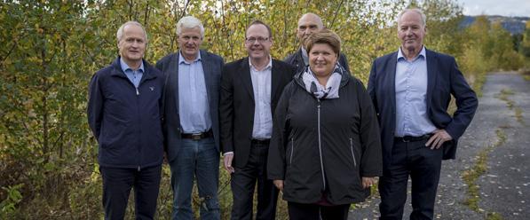 Med Mjøsbyen AS inngikk Arthur Buchardt og Knut Hage en historisk avtale med grunneierne Moelven Industrier og Strand Brænderi om bygging av inntil 2.000 boliger, næringsutvikling og handel i Moelv.