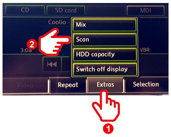 2. Trykk på «Extras» knappen (1), og velg deretter «Scan» (2) knappen. 3.