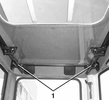 Drift Lukke Trykk høyre og venstre låsehåndtak (1) inn samtidig, og trykk deretter frontruten forover til endepunktet i styreskinnene. Lås frontruten i endepunktet ved å slippe låsehåndtakene.