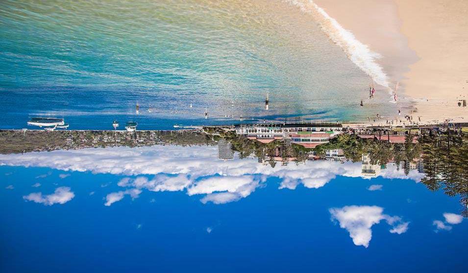 Slapp av på Manly Beach i Sydney utsikt over byen, og spesielt havneområdet og operahuset. Sydney er en fantastisk sjarmerende storby med en lang rekke attraksjoner.