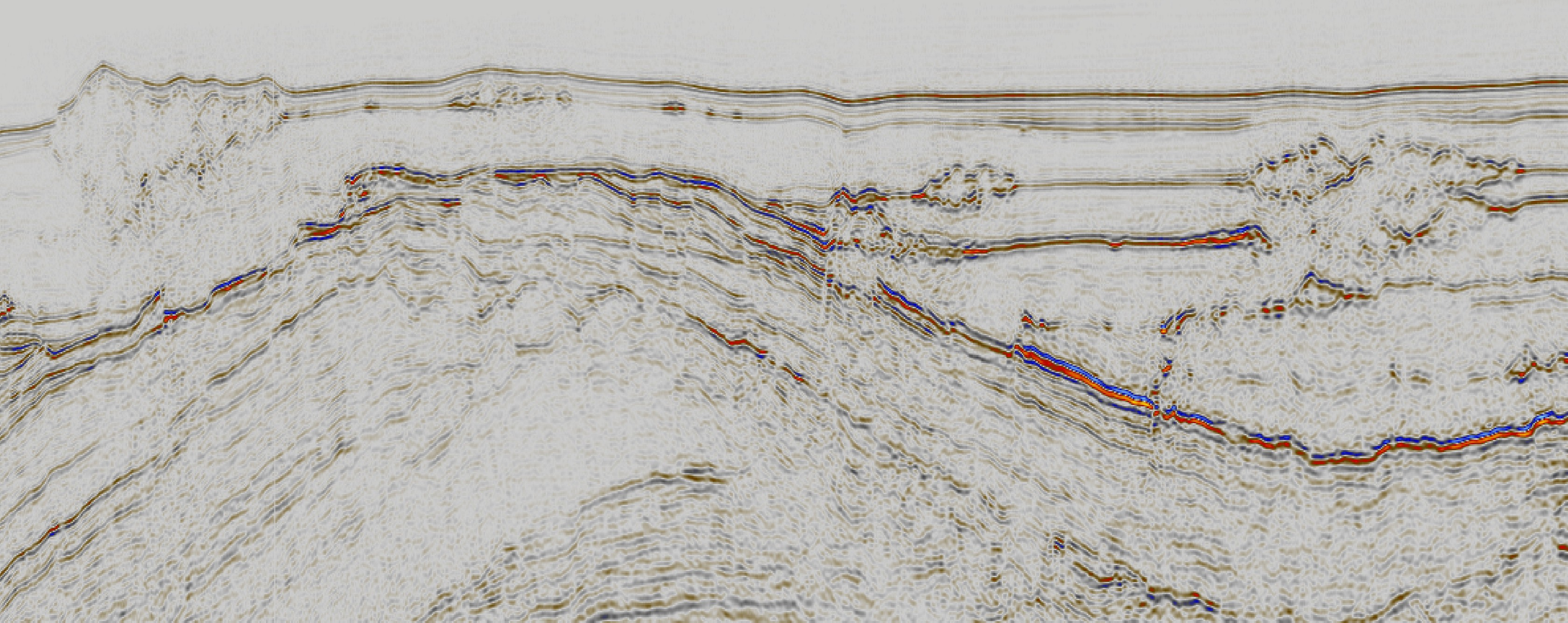 V Ø Figur 1.2. Seismisk linje som viser både havbunnsstrukturer og underliggende linser. Snittet viser Vemadomens relieff med strukturer både langs havbunnen og innen ulike lagpakker.
