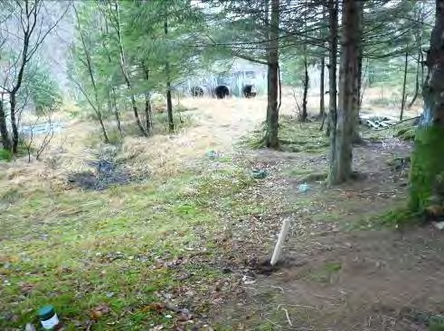 Prøvegrop nr.: PG26 Lokalisering: Tidligere øvingsplass i skogen sør for leiren, se tegning G1 Dyp, m Prøve Beskrivelse Merknad 0-0,1 PG26, 0-0,1 Dekke av gress/barnåler.