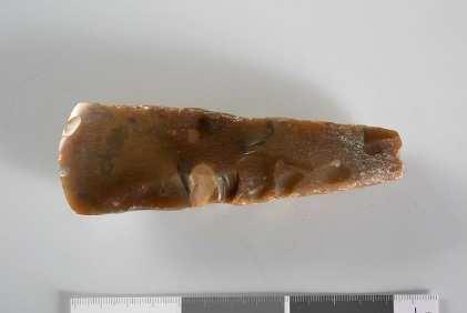 C.nr.22519 Nøkkel i bronse fra vikingtid. Dette er en av de mange gjenstandene som ble funnet ved undersøkelse av en gravhaug på gravfeltet Skinnfellholtet på Ås, gnr.81.