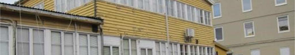 8 Inntil Ingeniørstallen ligger en gul trebygning fra 1949.