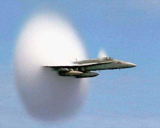 F/A-18 Hornet creates a shock wave as it breaks the sound barrier July 7 1999.