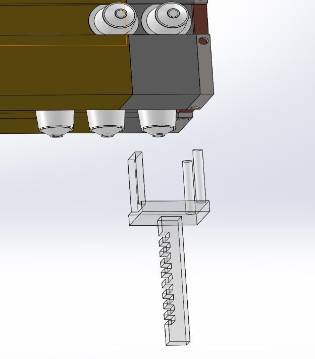 designet en utkasterarm som blokkerte den neste kapselen, men som samtidig ga nok uniformt trykk på skyveklossene så de ikke skulle låse seg men gli fint frem og tilbake.