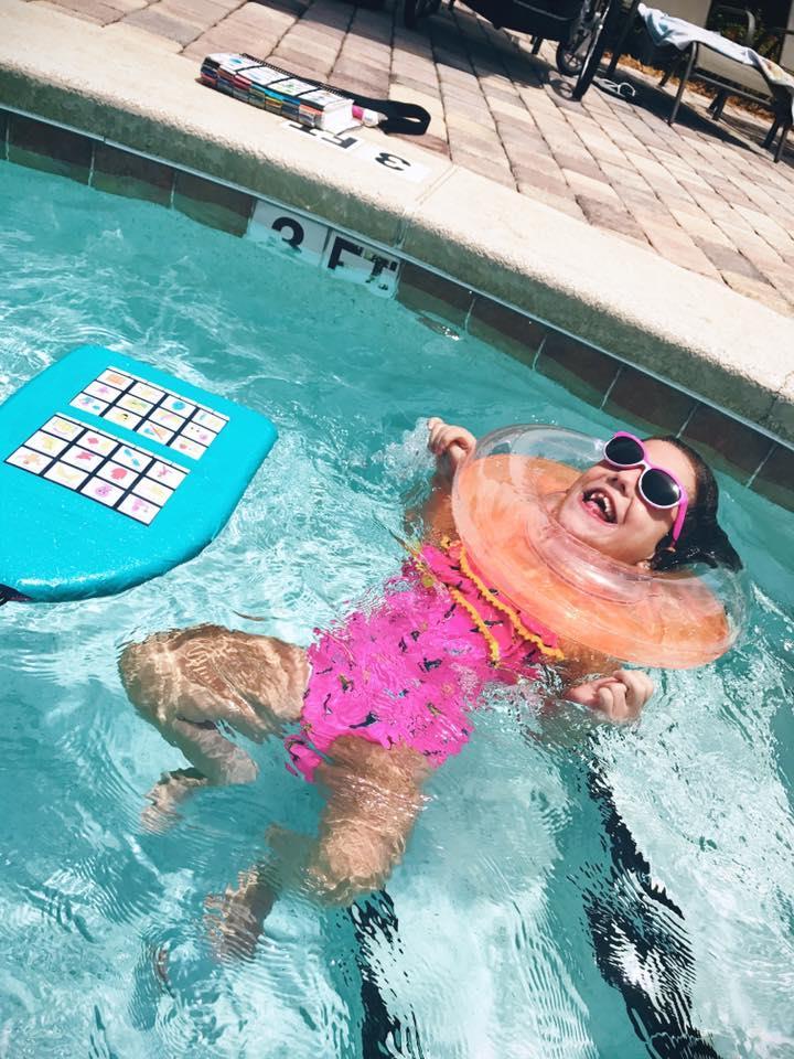 Happy Monday!. Summer is in full force here in Florida! Hot hot hot! Enjoying time in the pool and having fun communicating while we swim! Her kick board has her two pages of "qui.