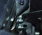 For ease of installing bolts one plastic push fastener on the inside of frame may be removed on
