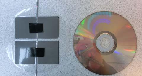 14. Tegn omrisset av en kassert CD-plate over det laminerte panelet (14a) og