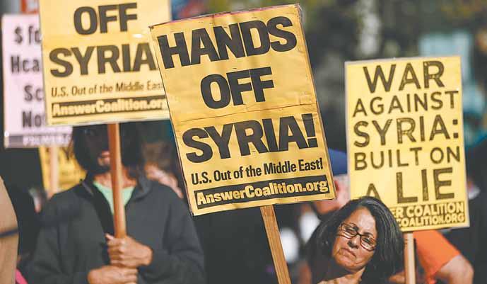 Vorarlberger KirchenBlatt 12. September 2013 Thema 11 Weltweit gibt es Proteste gegen einen Militärschlag des Westens gegen Syrien. Im Bild: eine Demonstration in San Francisco.