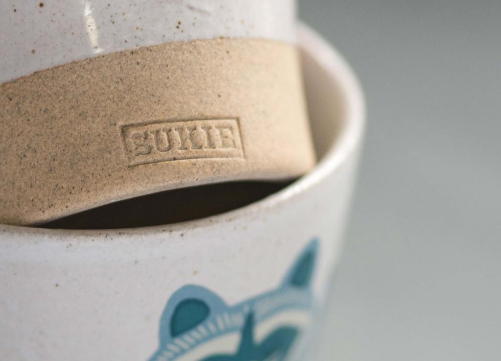 The designs on each side of the new Sukie mugs are subtly different.